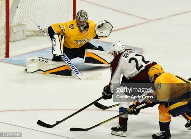 Colorado Avalanche center Colin Wilson winds up and shoots and gets blocked by Nashville Predators goaltender Pekka Rinne in the second period for...