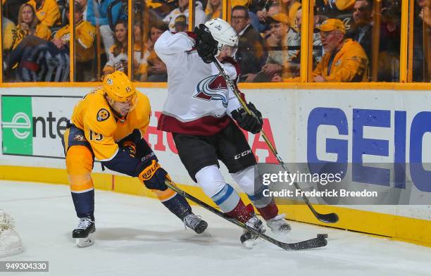 Craig Smith of the Nashville Predators fights Matt Nieto of the Colorado Avalanche for a puck during the second period in Game Five of the Western...
