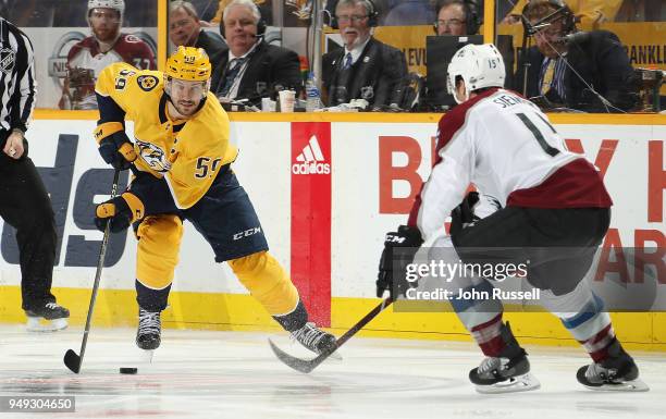 Roman Josi of the Nashville Predators skates against Duncan Siemens of the Colorado Avalanche in Game Five of the Western Conference First Round...