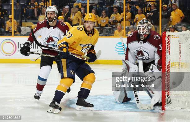 Viktor Arvidsson of the Nashville Predators battles between Mark Barberio and Andrew Hammond of the Colorado Avalanche in Game Five of the Western...
