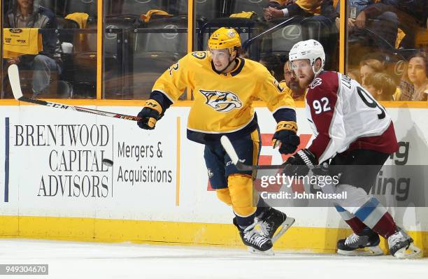 Kevin Fiala of the Nashville Predators battles for the puck against Gabriel Landeskog of the Colorado Avalanche in Game Five of the Western...