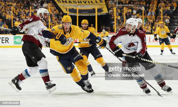 Kyle Turris of the Nashville Predators chases the puck between Mark Barberio and Alexander Kerfoot of the Colorado Avalanche in Game Five of the...