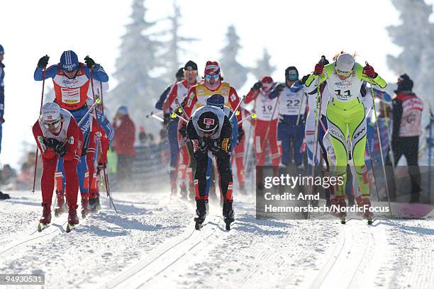 Vibeke Skofterud of Norway, Justyna Kowalczyk of Poland and Petra Majdic of Slovenia compete during the Women's 15km Mass Start in the FIS Cross...