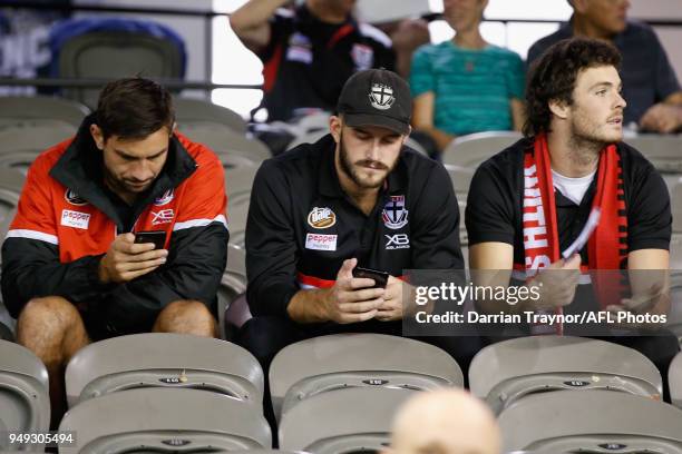 Billy Longer, Josh Bruce and Dylan Roberton of the Saints look on from the stands during the round five AFL match between the St Kilda Saints and the...