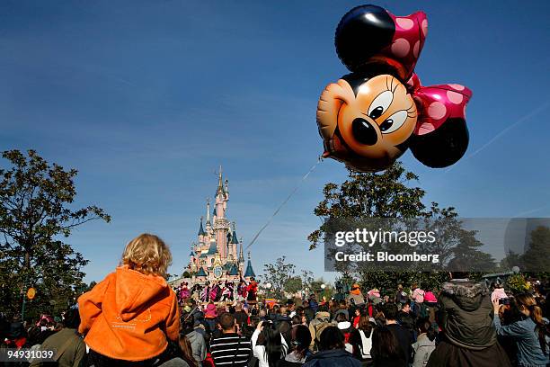 Minnie Mouse balloon floats in front of Cinderella's Castle at Disneyland Resort Paris, the amusement park run by Eurodisney in Marne-la-Vallee, near...