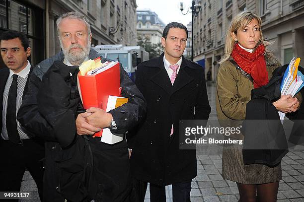 Jerome Kerviel, former Societe Generale trader, third from left, arrives with his lawyers, Bernard Benaiem, left, Eric Dupond-Moretti, second from...