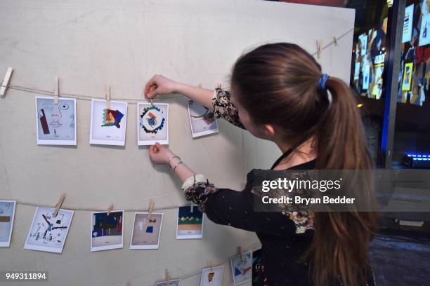 Guests interact with art during the National Geographic "Genius: Picasso" Tribeca Film Festival after party at The Genius Studio, 100 Avenue of the...