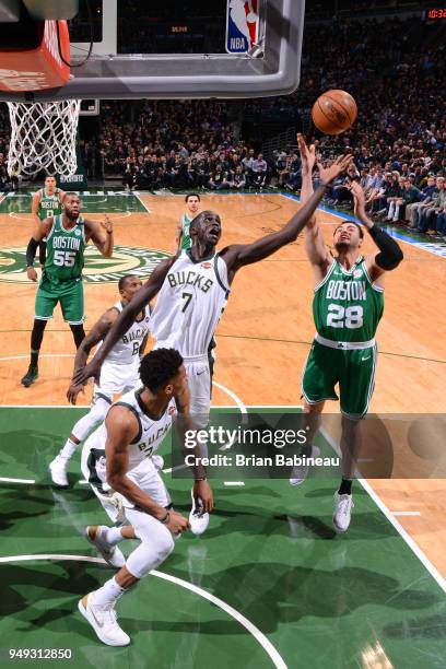 Milwaukee, WI Thon Maker of the Milwaukee Bucks and Abdel Nader of the Boston Celtics jump for the rebound in Game Three of Round One of the 2018 NBA...