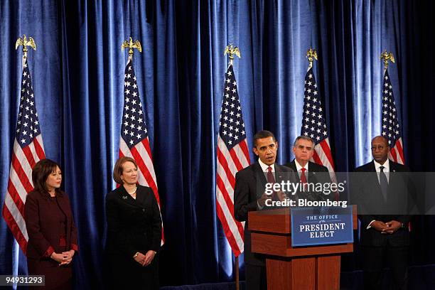 President-elect Barack Obama, at podium, introduces prospective members of his cabinet at a news conference in Chicago, Illinois, U.S., on Friday,...