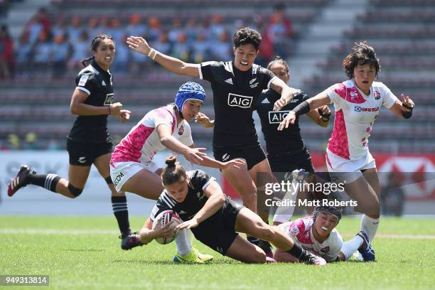 Michaela Blyde of New Zealand is tackled on day one of the HSBC Women's Rugby Sevens Kitakyushu Pool match between New Zealand and Japan at Mikuni...