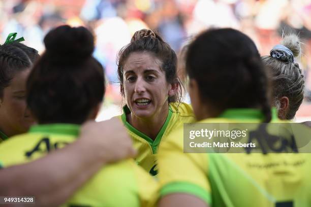 Alicia Quirk of Australia speaks to her team mates on day one of the HSBC Women's Rugby Sevens Kitakyushu Pool match between Australia and China at...