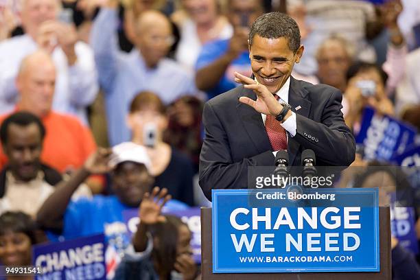 Senator Barack Obama of Illinois, Democratic presidential candidate, waves to an audience member during a campaign rally in Jacksonville, Florida,...