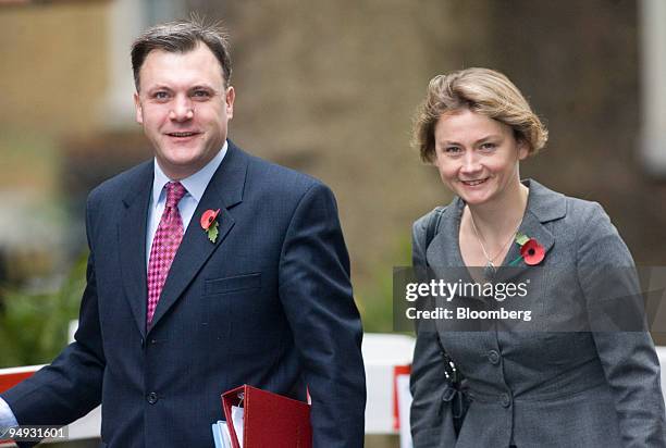 Ed Balls, U.K. Education secretary, left, and his wife Yvette Cooper, chief secretary to the Treasury, arrive for the weekly cabinet meeting at...