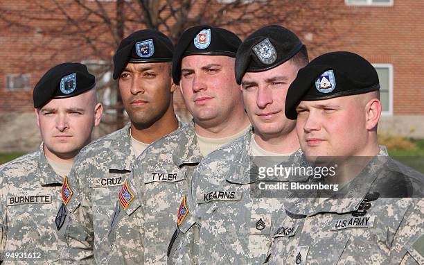 Standing from left to right are U.S. Army soldiers Captain Matthew Burnette, Staff Sergeant Michael Cruz, Specialist Michael Tyler, Staff Sergeant...