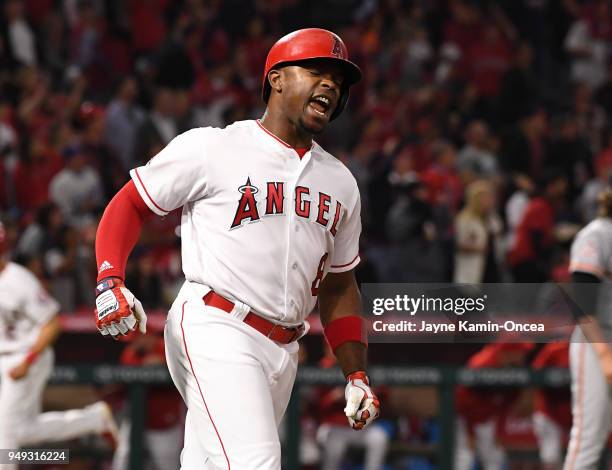 Justin Upton of the Los Angeles Angels of Anaheim reacts after hitting a fly ball for the third out with bases loaded off of Jeff Samardzija of the...