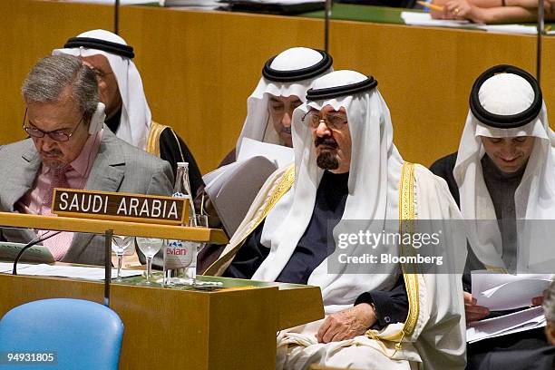 King Abdullah of Saudi Arabia, foreground right, listens during a United Nations interfaith conference at the UN in New York, U.S., on Thursday, Nov....