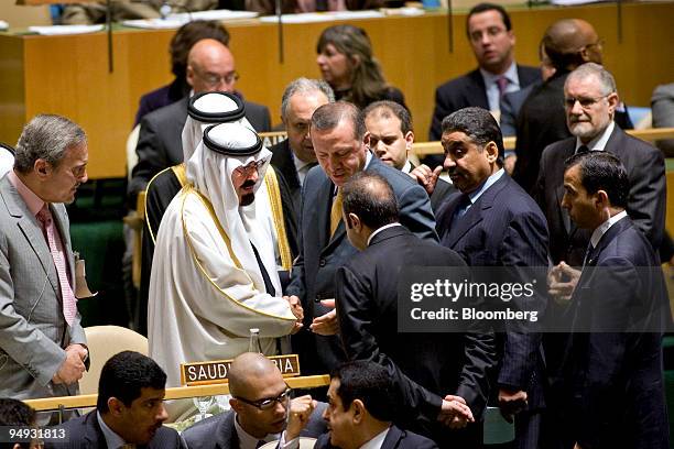 King Abdullah of Saudi Arabia, second from the left, shakes hands with Recep Tayyip Erdogan, Turkey's prime minister, during a United Nations...