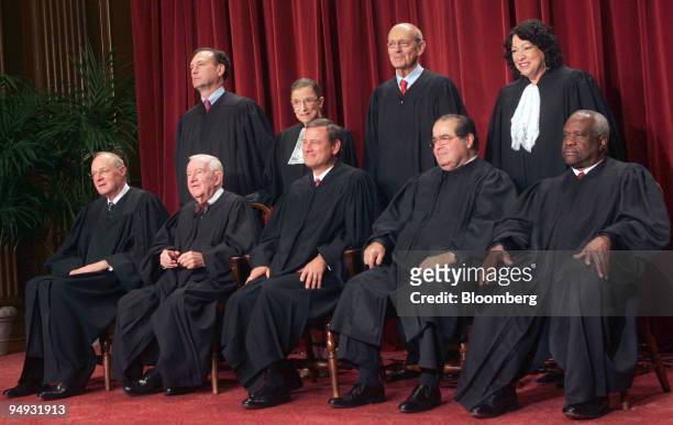 The justices of the U.S. Supreme Court pose for their official photo in Washington, D.C., U.S., on Tuesday, Sept. 29, 2009. Sitting from left in...