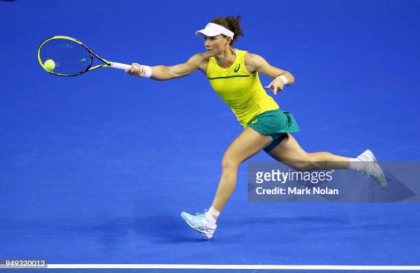 Samantha Stosur of Australia plays a forehand in her match against Lesley Kerkhove of the Netherlands during the World Group Play-Off Fed Cup tie...