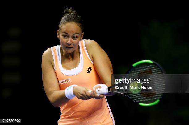 Lesley Kerkhove of the Netherlands plays a backhand in her match against Samantha Stosur of Australia during the World Group Play-Off Fed Cup tie...