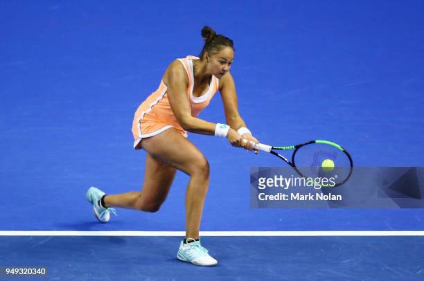 Lesley Kerkhove of the Netherlands plays a backhand in her match against Samantha Stosur of Australia during the World Group Play-Off Fed Cup tie...