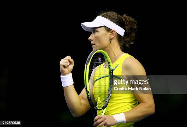 Samantha Stosur of Australia celebrates a point in her match against Lesley Kerkhove of the Netherlands during the World Group Play-Off Fed Cup tie...