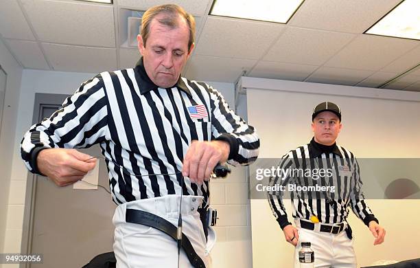 Referee Greg Burks, left, and back judge Shawn Hochuli get ready to officiate a football game between Iowa State University and the University of...