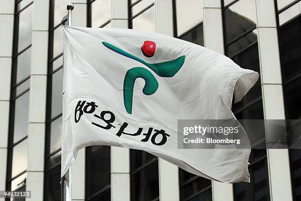 The flag of Hana Bank is displayed outside the bank's headquarters in Seoul, South Korea, on Monday, Nov. 17, 2008. South Korea is boosting spending...