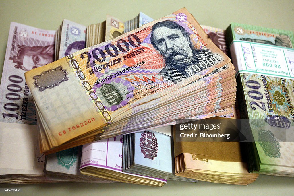 Hungarian Forint notes of differing denominations sit on dis