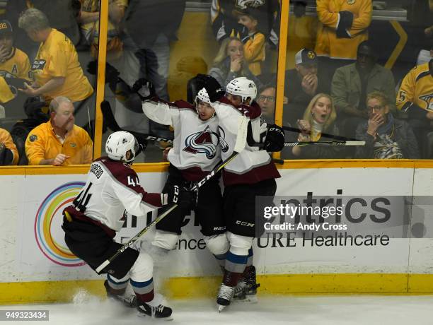 Colorado Avalanche defenseman Mark Barberio and Colorado Avalanche left wing Gabriel Bourque celebrate with teammate Colorado Avalanche right wing...