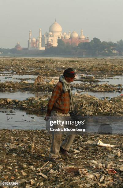 Man walks along the banks of the polluted Yamuna river in Agra, India, on Tuesday, Nov. 25, 2008. The polluted Yamuna river runs alongside the Taj...