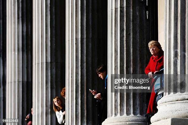 Visitors look out from between the pillars at the National Gallery in London, U.K., on Monday, Dec. 1, 2008. London's National Gallery and the...