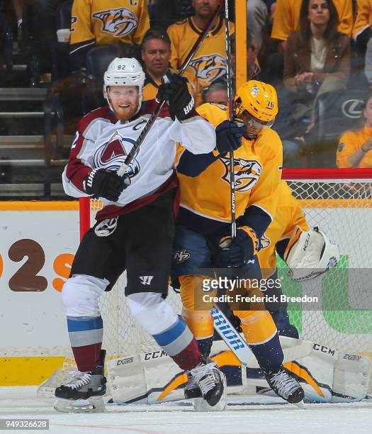 Gabriel Landeskog of the Colorado Avalanche and P.K. Subban watch as a puck comes in front of goalie Pekka Rinne of the Nashville Predators during...