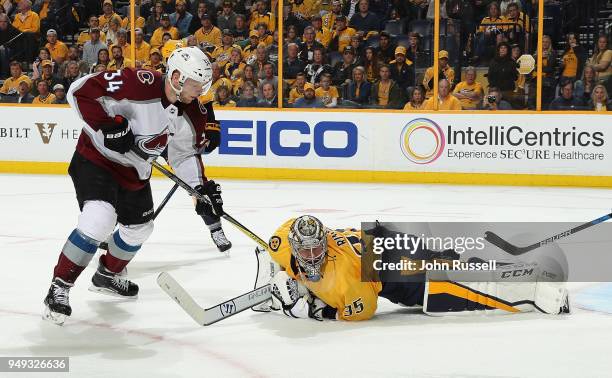 Pekka Rinne of the Nashville Predators secures the puck against Carl Soderberg of the Colorado Avalanche in Game Five of the Western Conference First...