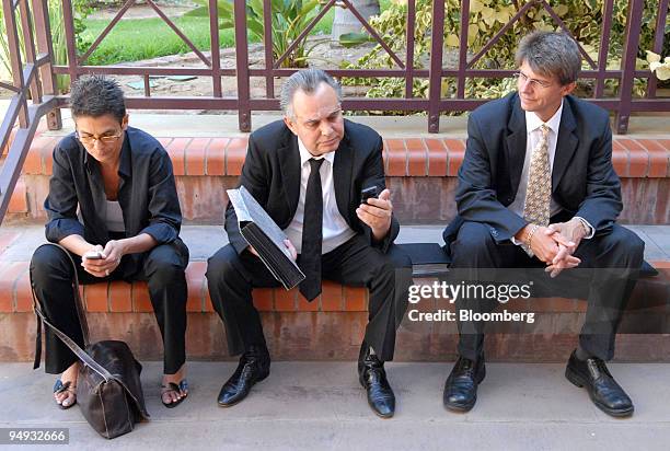 Jacob " Kobi'' Alexander, the former Comverse Technology Inc. Chief executive officer, center, accompanied by his wife Hana, left, and his lawyer,...