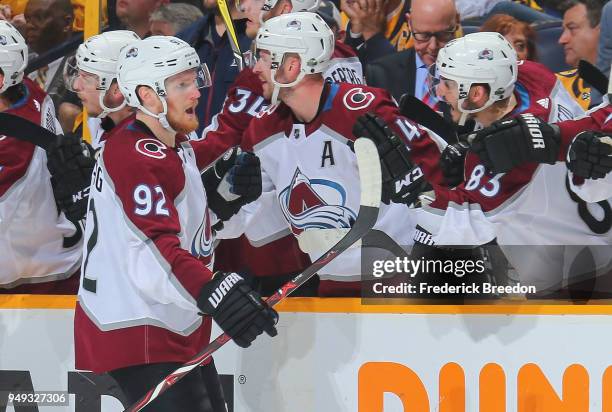 Gabriel Landeskog of the Colorado Avalanche is congratulated by teammates after scoring a goal during the third period of a 2-1 Avalanche victory in...