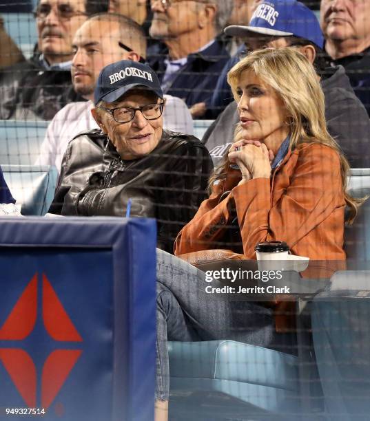 Larry King and wife Shawn King attend The Los Angeles Dodgers Game at Dodger Stadium on April 20, 2018 in Los Angeles, California.