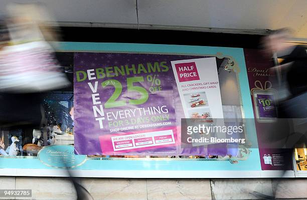 Pedestrians walk past the Debenhams department store on Oxford Street, in London, U.K., on Thursday, Nov. 20, 2008. U.K. Retail sales fell less than...