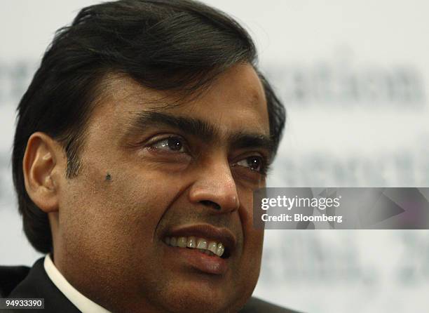 Mukesh Ambani, chairman and managing director of Reliance Industries Ltd., listens at the GreatCorps World Business Statesman Lecture, in New Delhi,...