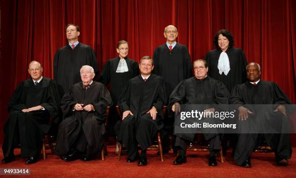 The justices of the U.S. Supreme Court pose for their official photo in Washington, D.C., U.S., on Tuesday, Sept. 29, 2009. Seated from front left...