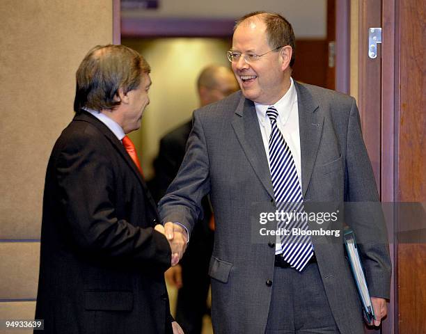 Jeannot Krecke, Luxembourg's minister of economy and foreign trade, left, greets Peer Steinbrueck, Germany's finance minister, upon their arrival for...