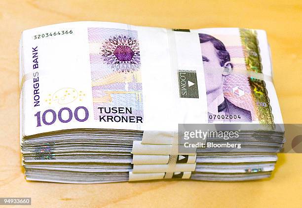 Bundle of Norwegian Krone notes sit on display at a bank in Oslo, Norway, on Monday, Dec. 1, 2008. Norway?s krone declined as data showed retail...