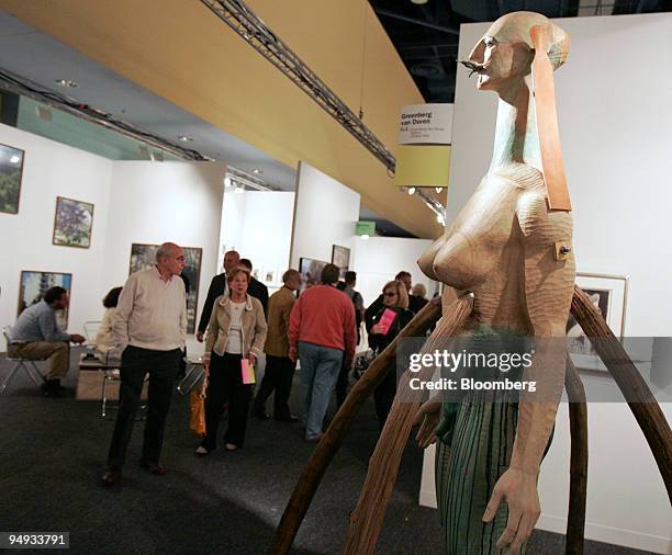 The Sphinx is Eating a Grasshopper above the Forest" by Katsura Funakoshi, right, sits on display in the Greenberg Van Doren Gallery booth during a...