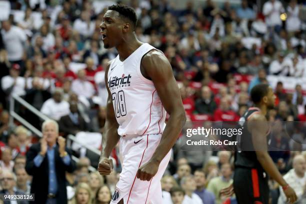 Ian Mahinmi of the Washington Wizards celebrates in the first half against the Toronto Raptors during Game Three of Round One of the 2018 NBA...