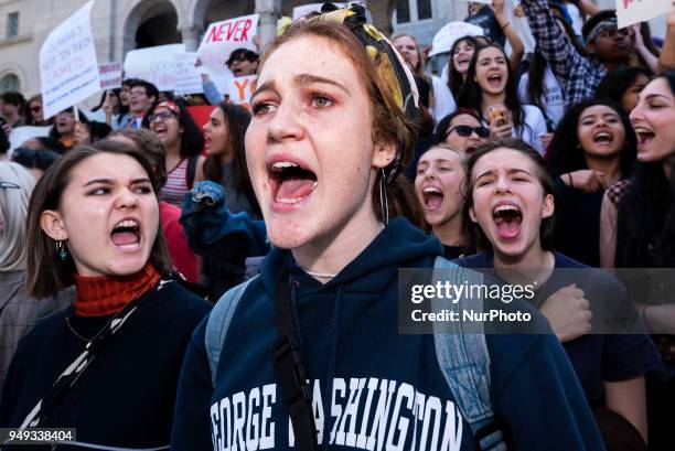 Students participate in a protest against gun violence during the National School Walkout in Los Angeles, California on April 20, 2018. Students and...