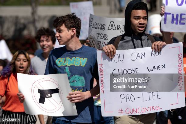 Students participate in a protest against gun violence during the National School Walkout in Los Angeles, California on April 20, 2018. Students and...