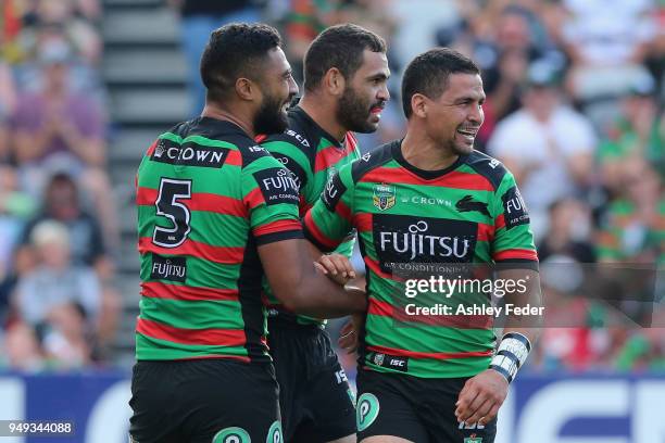 Greg Inglis of the Rabbitohs celebrates his try with team mates during the round seven NRL match between the South Sydney Rabbitohs and the Canberra...