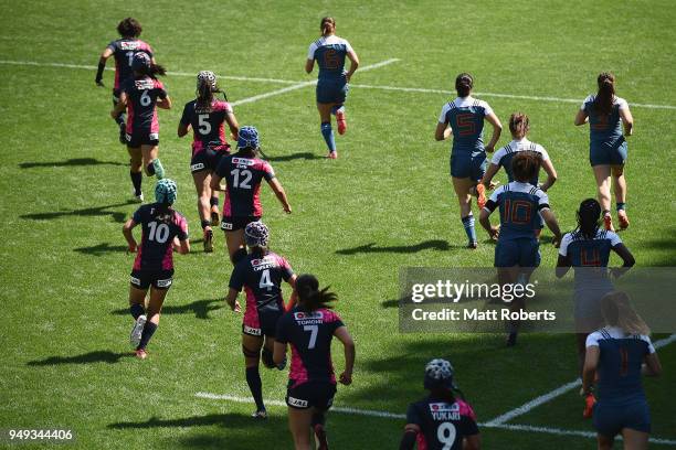 Players of Japan and France run onto the field on day one of the HSBC Women's Rugby Sevens Kitakyushu Pool match between France and Japan at Mikuni...