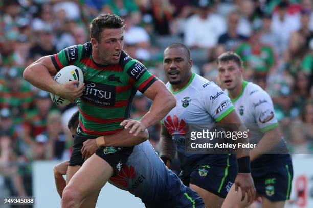 Sam Burgess of the Rabbitohs is tackled by the Raiders defence during the round seven NRL match between the South Sydney Rabbitohs and the Canberra...