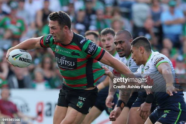 Sam Burgess of the Rabbitohs is tackled by the Raiders defence during the round seven NRL match between the South Sydney Rabbitohs and the Canberra...